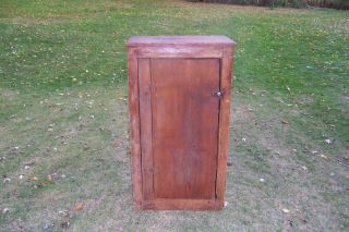 Antique Primitive Early 1800s Wooden One Door Cupboard With Old Red Finish photo