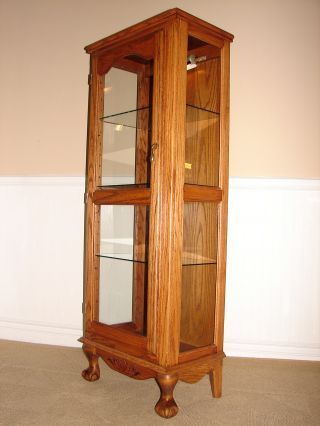 Oak Curio Cabinet,  Illuminating Display Shelves,  Claw And Ball Feet photo