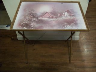 Vintage Folding Table With Painting Ontop photo