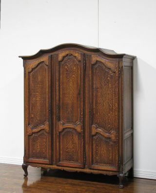 8811000 : Oak French Provincial Three Door Armoire photo