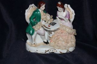 Antique Porcelain Figurine Man And Woman Playing Chess Statue Figurine photo