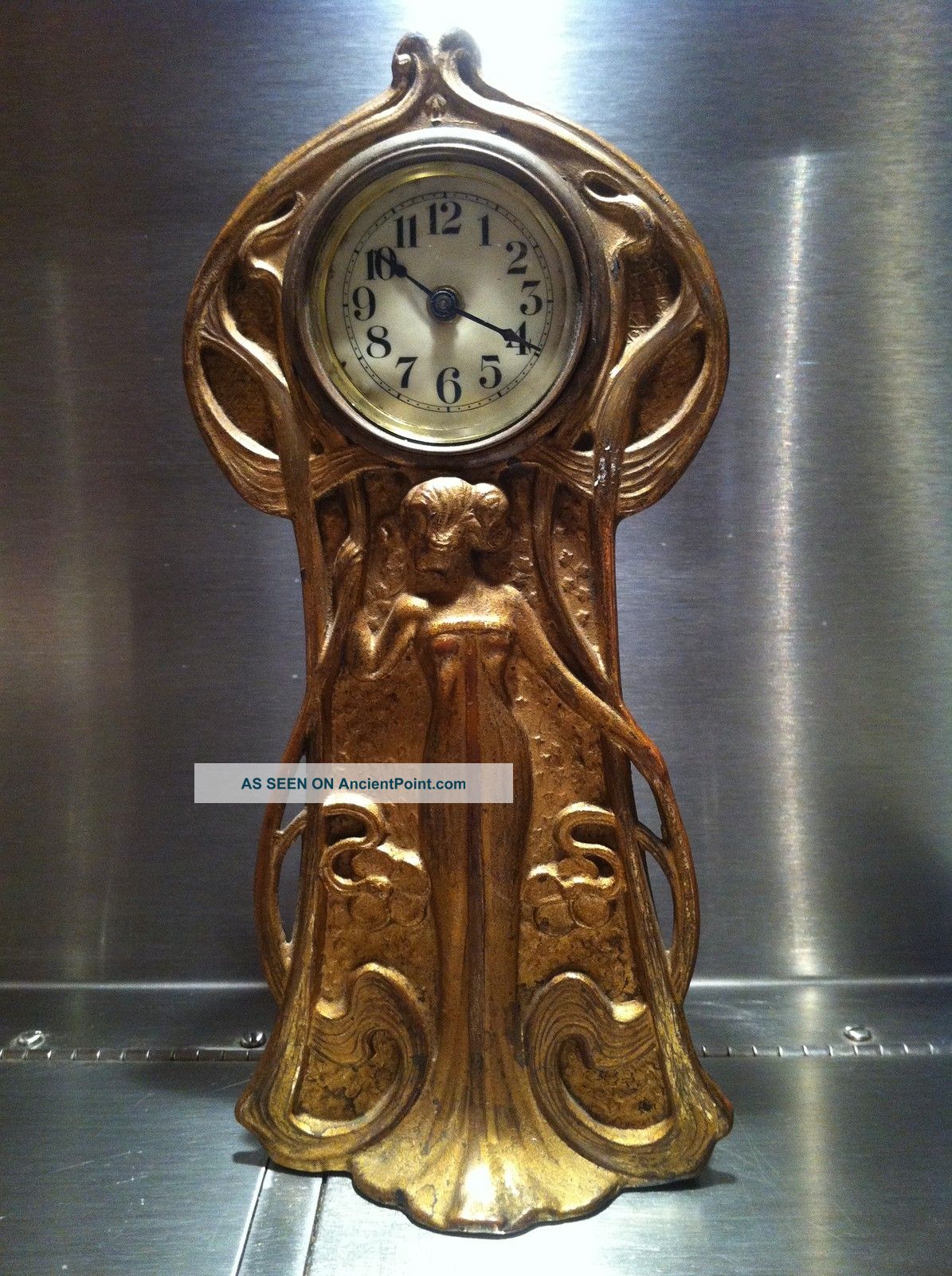 Art Nouveau 1908 Figural Clock With Clovers Clocks photo