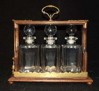 Antique Cristal,  Wood And Brass Tantalus Set,  With Three Decanters photo