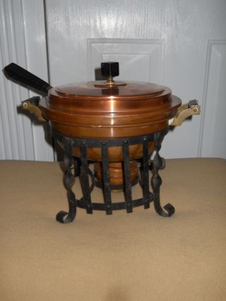 Antique Copper Chafing Dish On A Black Wrought Iron Stand With Burner photo