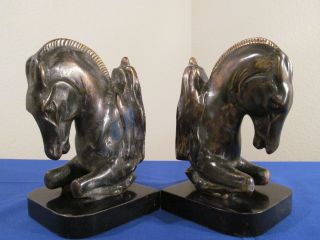 Metal Bookends Antique On Black Marble photo