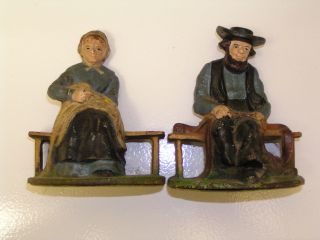 Antique Cast Iron Doorstop Bookends Amish Couple Penn.  Dutch photo