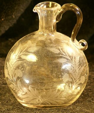 Vintage Decanter With Etched Flowers And Leaves photo