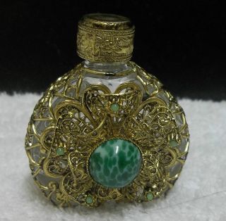 Perfume Bottle Glass Enclosed With Filigree Goldtone Metal Green Stone On Front photo