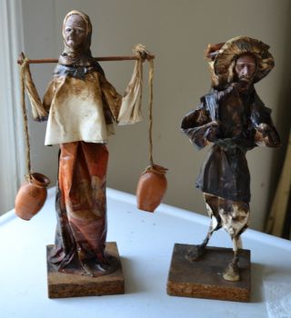 2 Folk Art Peasant Figures,  Banana Leaves,  Dried Fruit,  Lacquered Paper photo
