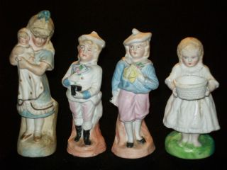 4 Antique German Porcelain Bisque Figurines 2 Girls & 2 Boys photo