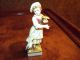 Antique Hand Painted Porcelain Figurine Of Girl Holding Basket Of Grain. Figurines photo 1
