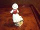 Antique Hand Painted Porcelain Figurine Of Girl Holding Basket Of Grain. Figurines photo 2