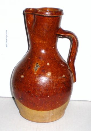 Antique Brown Glazed Stoneware Pitcher,  Pinched Spout,  Unglazed Base And Bottom photo