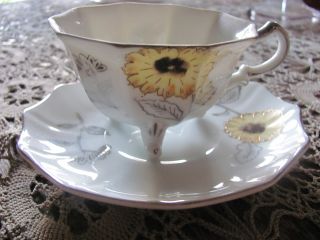 Unique Ceramic Footed Cup & Saucer By Vcagco?? White,  Silver,  Yellow,  Brown photo