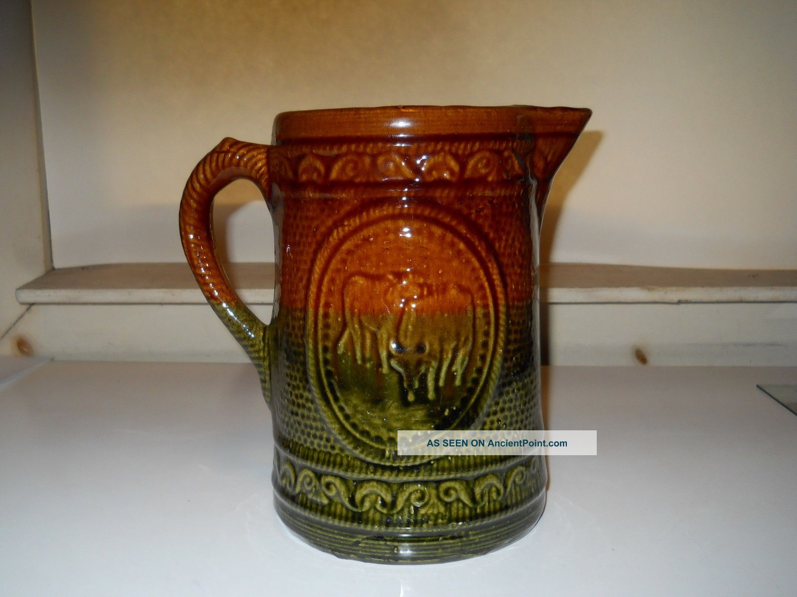Antique Stoneware Pitcher W/ Emb.  Cows Design Brown/green Glaze Rare Mint Cond. Pitchers photo