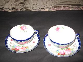 Two Pretty Teacups And Saucers With Roses,  Blue And White With Decorative Gold photo