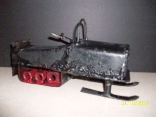 Vintage Folk Art Snowmobile/metal photo