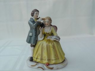 Antique Couple Figurine Playing Violin To His Girl photo