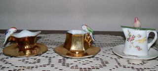 3 Vintage Miniature Cups And Saucers With Parrots On Top photo