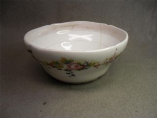 Antique Bowl Flower Pattern With Stapled Repairs photo