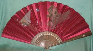 Antique Fan With Fishing Boat And Ghost House photo