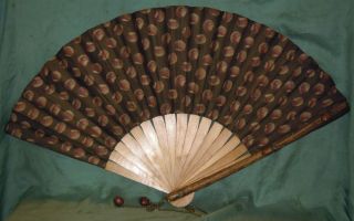 Antique Fan Decorated With Hazelnuts photo
