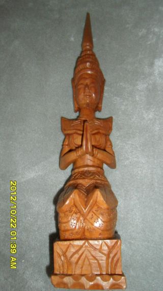 Handcarved Polished Wood Figurine photo