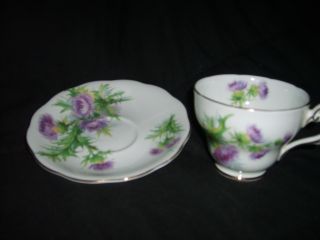 White With Purple Flowers Teacup With Saucer photo