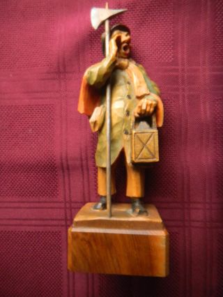 Black Forest Wood Carving Of A Lamp Lighter Or Town Crier Or Yodeller ? With Axe photo