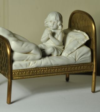 Extremely Rare Bisque Porcelain Figurine Girl Praying Sitting In Brass Bed photo