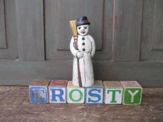 Antique Wood Blocks Spell Frosty photo