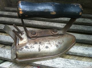 Old Vintage Farmhouse Iron With Wood Handle photo