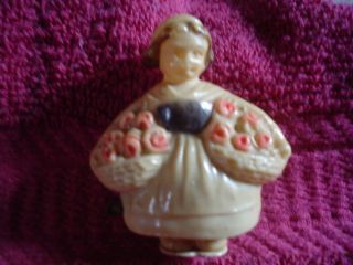 Figural Tape Measure Girl With Flower Baskets photo