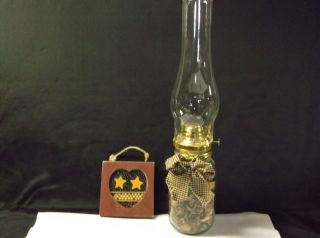 Mason Jar Oil Lamp And Wooden Bean Plague photo