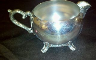 Vintage W.  M.  Rogers Silver - Plate Footed Creamer photo