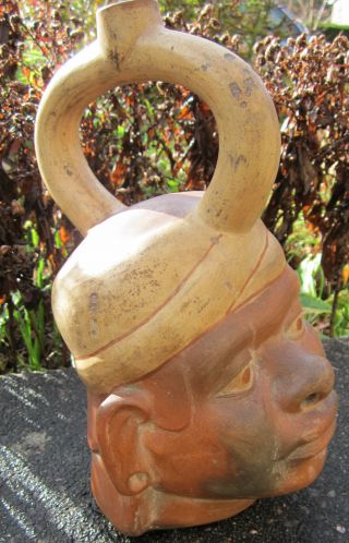 Moche Portrait Vessel.  Stirrup - Spout.  Peruvian Ceramics.  Terracotta.  Precolumbian. photo