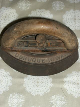 Antique Sad Iron With Wood Handle Release On The Handle photo