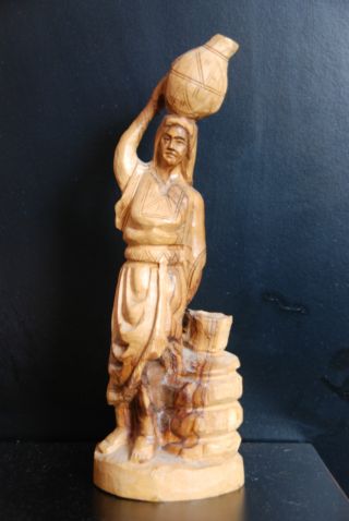 Old And Interesting Root Wood Carved Statue Woman With Water/wine photo