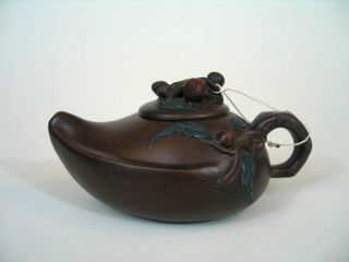 A Chinese Yixing Teapot In The Peach Shape With Maker ' S Mark photo