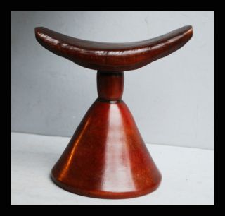 A Very Glossy And Pretty Red Wood Headrest From Ethiopia photo