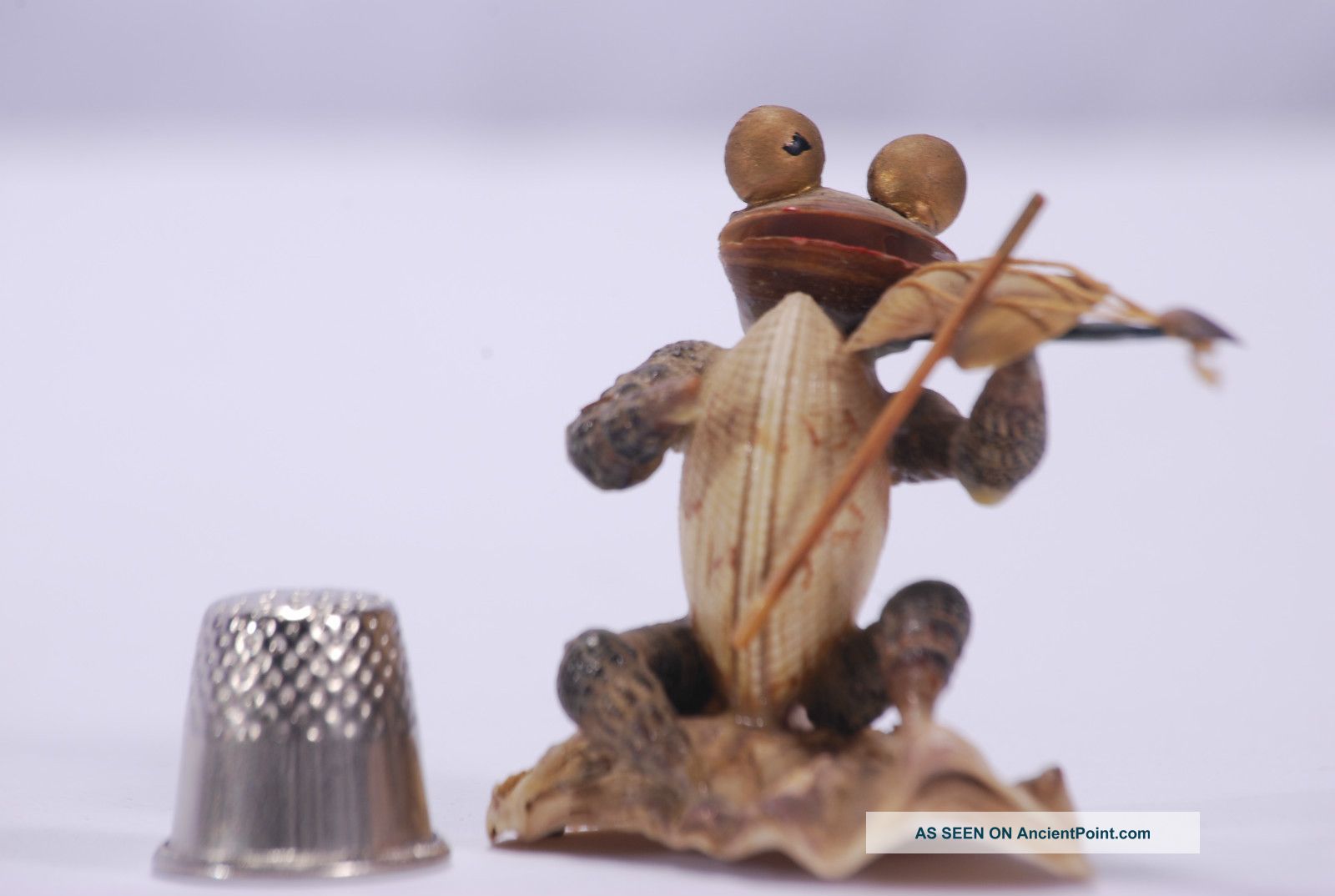 Sea Shell Violin Player With Big Round Eyes,  Made Entirely Out Of Shells Statues photo