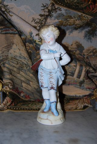 Victorian Style German Hand Painted Bisque Or Parian Boy Figurine In Pastels photo