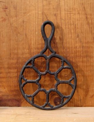 Antique Cast Iron Footed Trivet W Handle - Neat Architectural Design photo