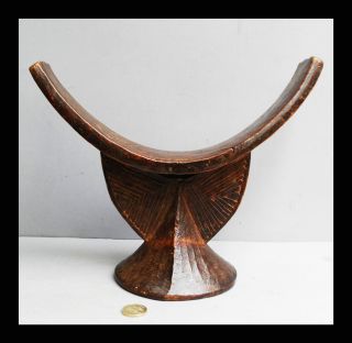 A Large And Attractive Somali Headrest With Striking Form photo