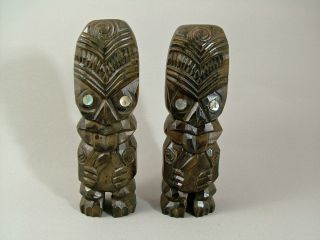 A Pair Of Hand Carved Maori Tiki Figures. photo