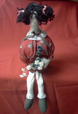 Seated Fabric Doll In Christmas Theme Clothing photo