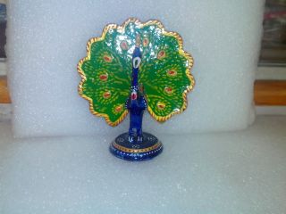 Classical Dancing White Metal Peacock Symbolize For Rain In India In Gems Work photo