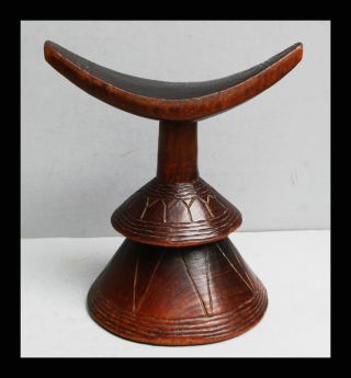 A Bold Ethiopian Headrest With Double Skirt Design photo