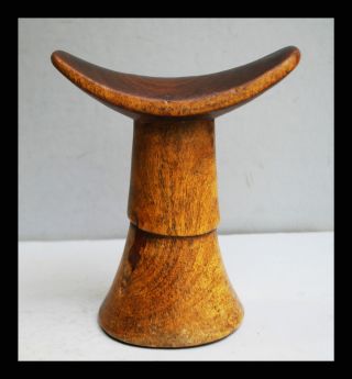 A Well Patinated Ethiopian Headrest With Simple Design photo