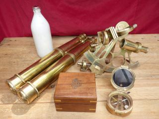 A Kelvin & Hughes Sextant,  A Brass Bearing Compass,  Brass Long Tubed Binoculars photo